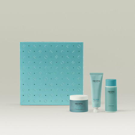 Tropic Skincare gift set titled The Softening Foot Spa – repair and revitalise collection, featuring Foot Smooth, Foot Remedy, and Foot Soak, displayed in front of a turquoise gift box with embossed detailing.